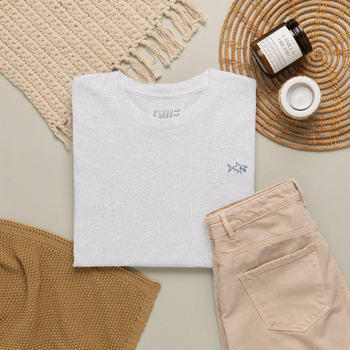 Minimalist string design Fish Tee — Small Chest Fish & Back 'OWE' Graphic