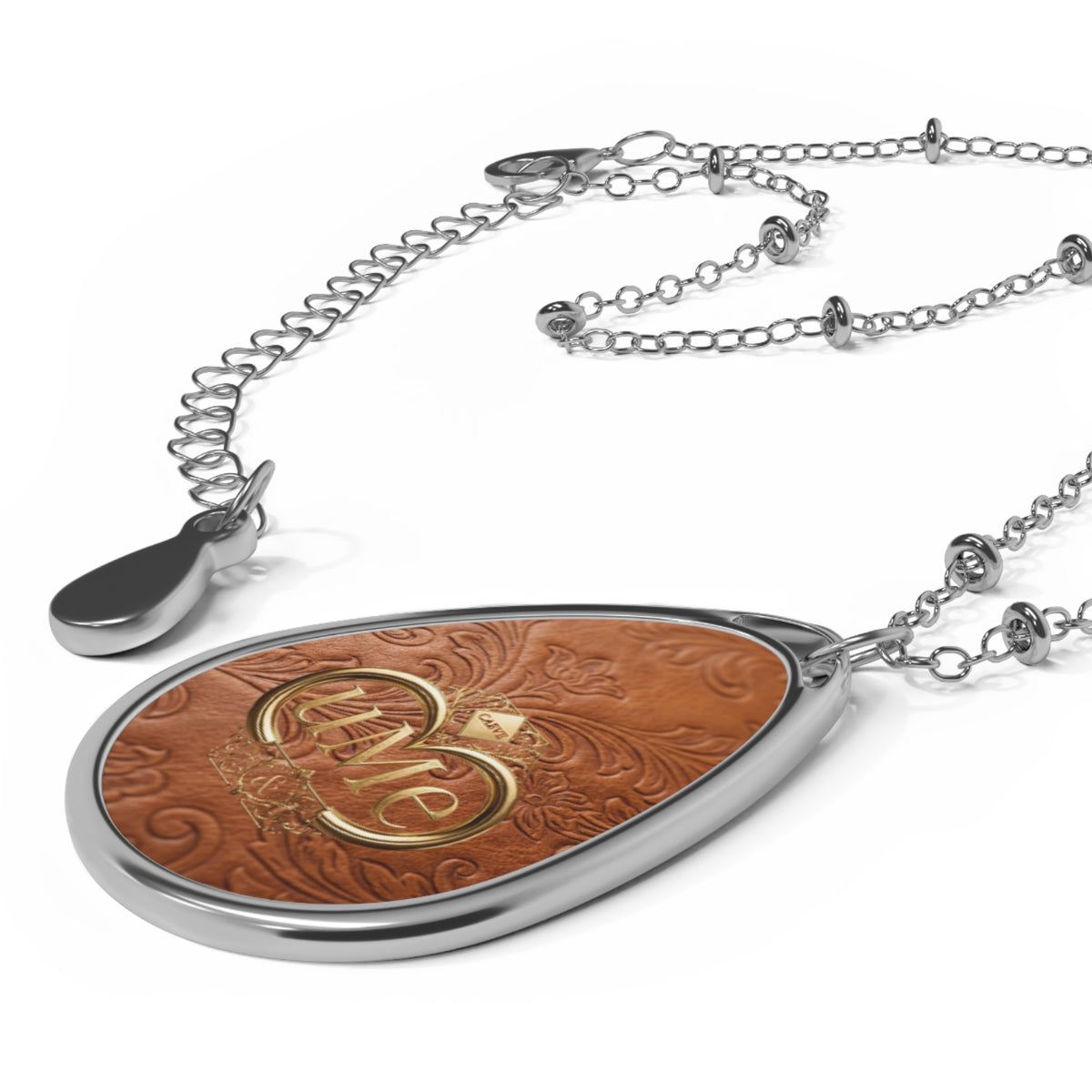 Tan Brown UME Teardrop Pendant Necklace — Silver-Colored Frame & Scroll Print