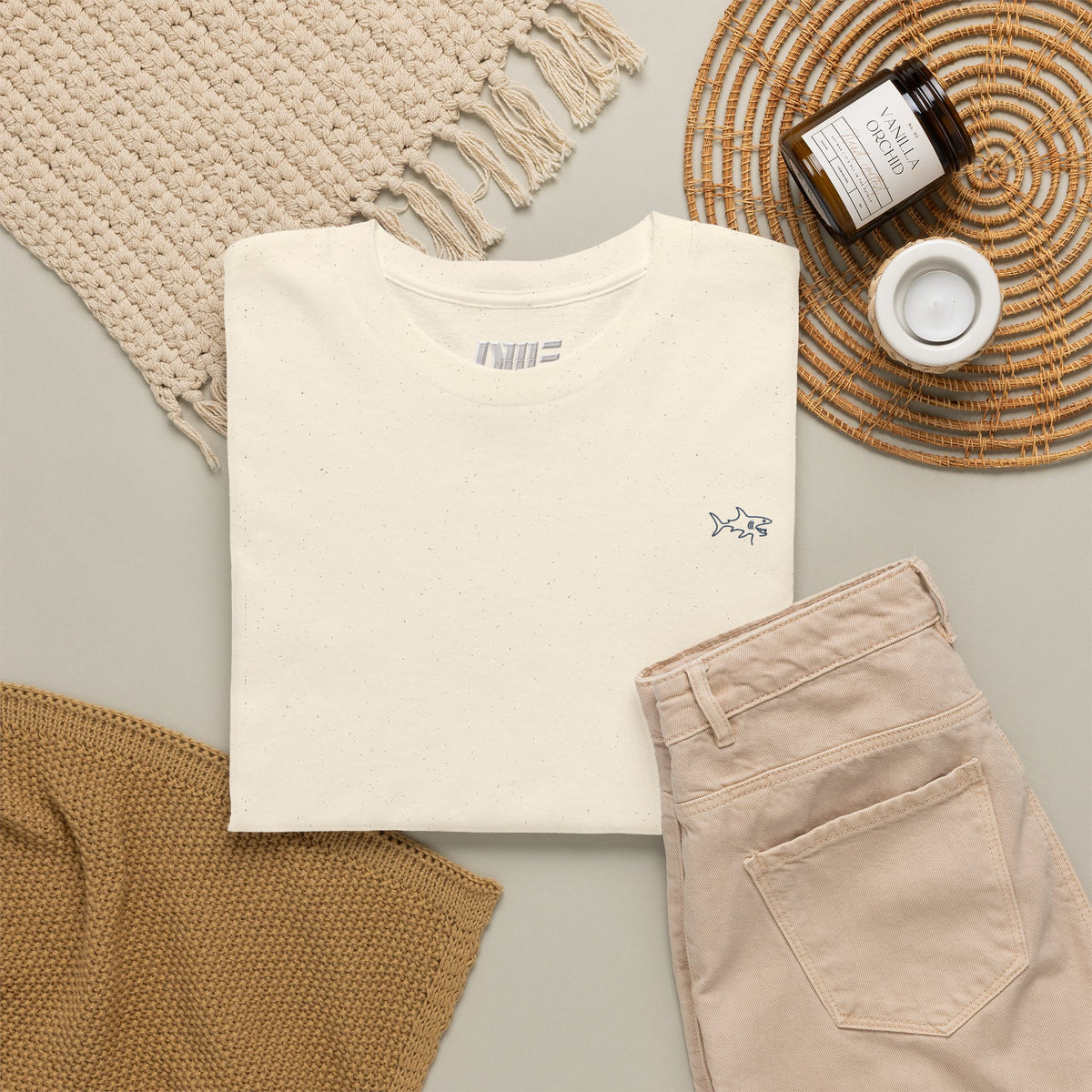 Minimalist string design Fish Tee — Small Chest Fish & Back 'OWE' Graphic